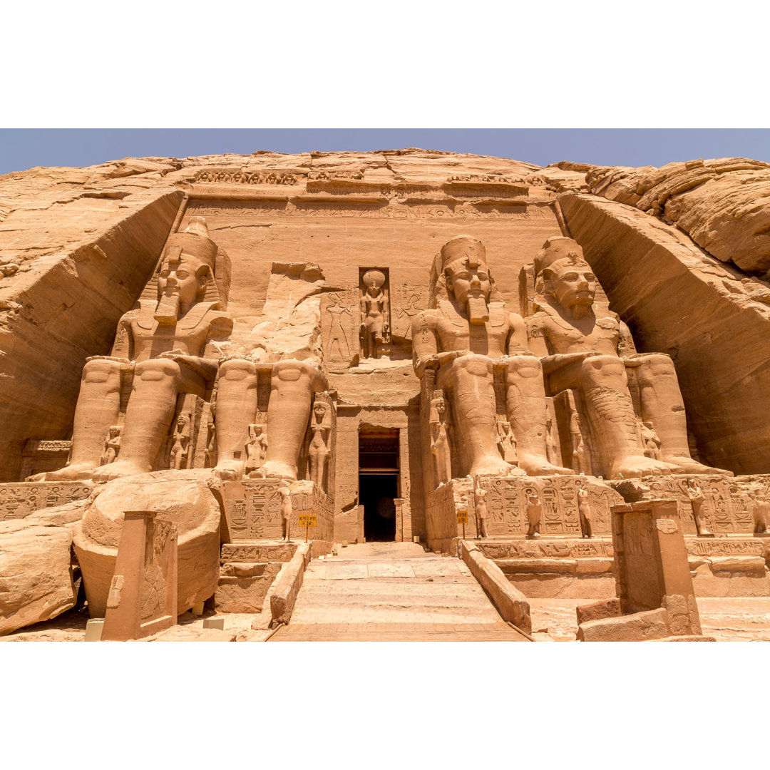 Statues In Front Of Abu Simbel Temple In Aswan Egypt by Nodostudio - Wrapped Canvas Print