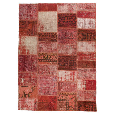 Tapis rouge en laine noué à la main
