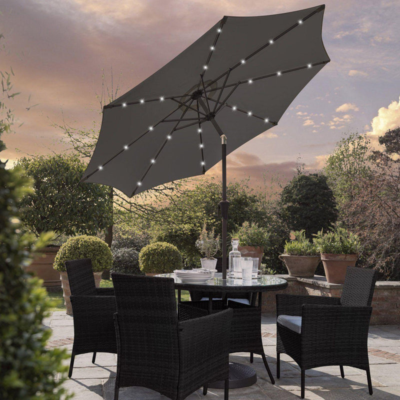 Dubose 4 - Person Wicker Patio Dining Set with Round Table , Cushions Included, Black, Yes