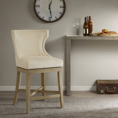 Tabouret de bar pivotant à oreilles rembourré Carson couleur crème