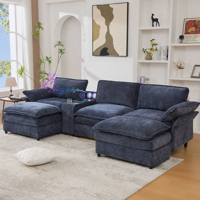Canapé modulaire en U avec rangement, chargement sans fil, haut-parleurs Bluetooth et repose-pieds mobiles pour un confort et un divertissement ultimes