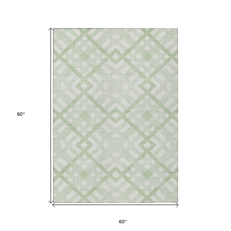Tapis extérieur lavable géométrique vert menthe et ivoire 5 pi x 8 pi