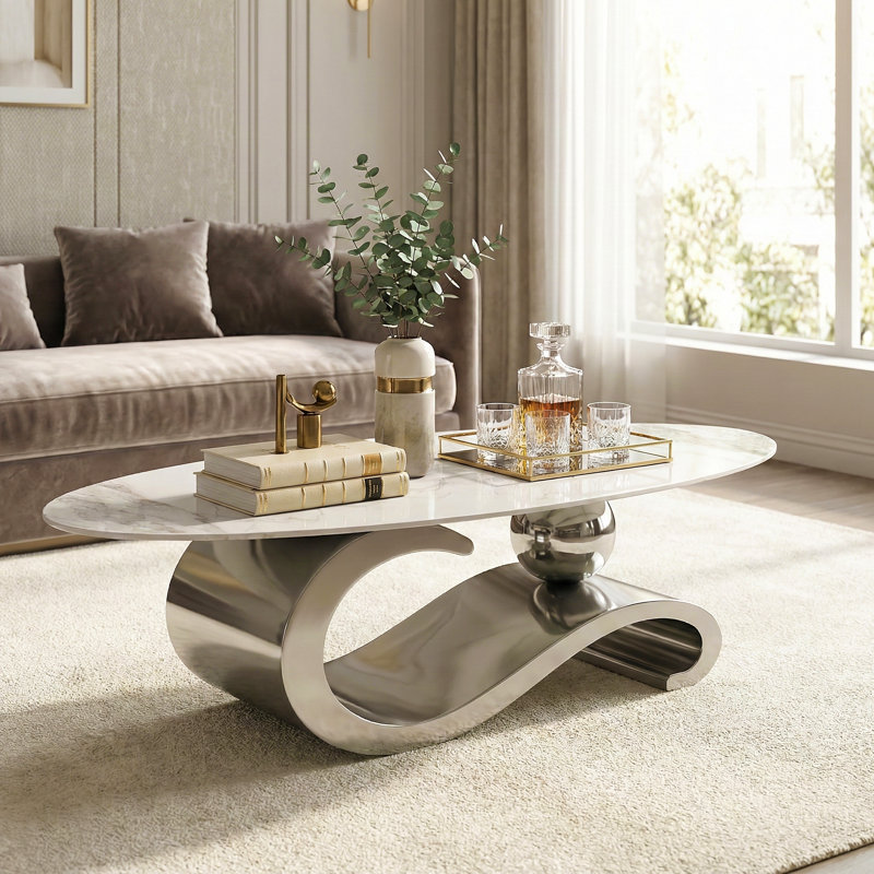 Aneia 51.2'' L Oval Coffee Table with Musical Note Base, Silver