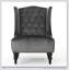 Fauteuil club à dossier haut avec dossier à oreilles, coutures capitonnées et pieds tournés pour un confort et un style modernes