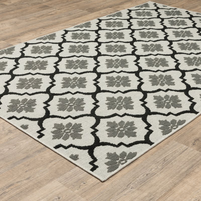 Tapis intérieur / extérieur géométrique / floral beige / noir Inessa