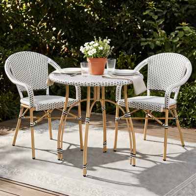 Ensembles de salle à manger de patio intérieur / extérieur Altesa toutes saisons avec table ronde en rotin et chaises empilables
