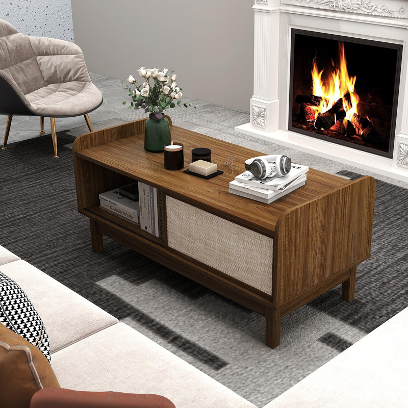 Table basse Ebern Designs avec porte coulissante et étagère réglable