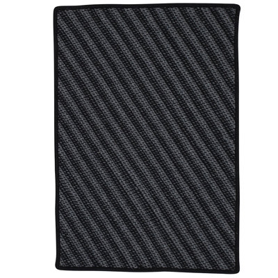 Tapis noir tressé à motif géométrique Ommegang