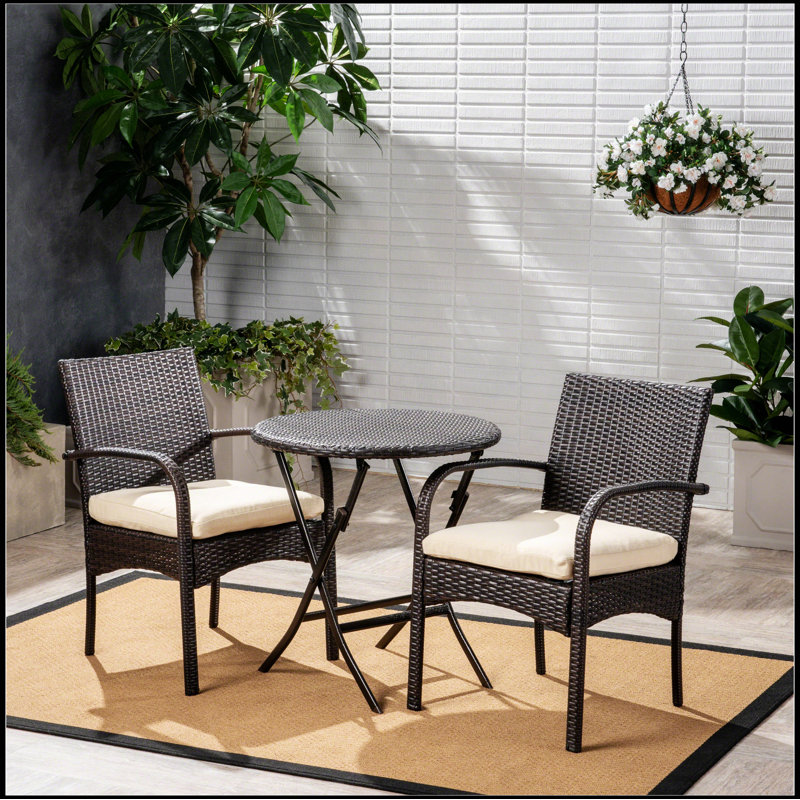 Bistro, with two upholstered chairs and a table, all wrapped in high quality wicker