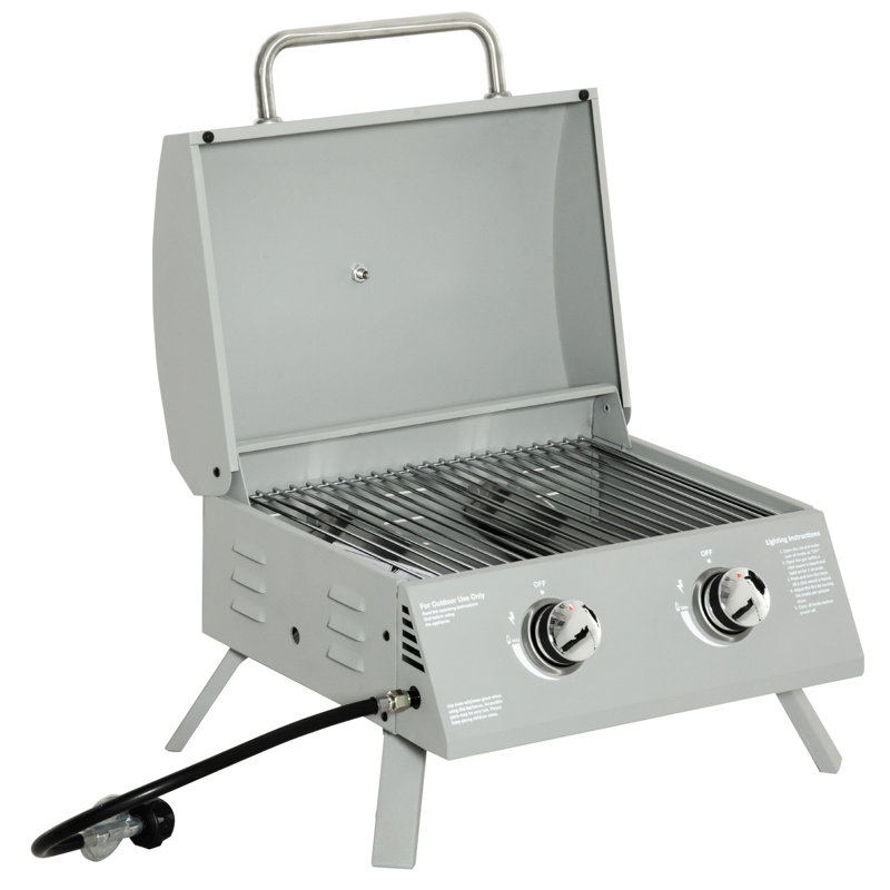 Plateau de table portatif au propane Gris. Pieds pliables pour la mobilité. Pour le camping, le pique-nique, la cour. Couvercle, thermomètre, plateau à graisse. Barbecue au gaz à 2 brûleurs L 21,75 po x l 18,25 po H 16,25 po. Avec pieds.