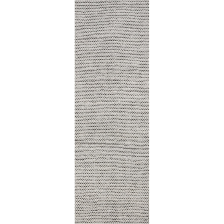 Tapis gris clair en laine tressé à la main