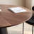 Walnut-colored patterned round dining table-1120521393