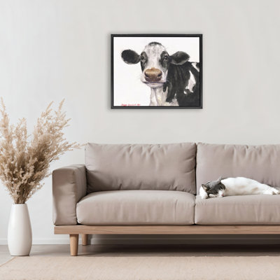 Mignonne vache avec cadre flottant à taches blanches, design par George Dyachenko