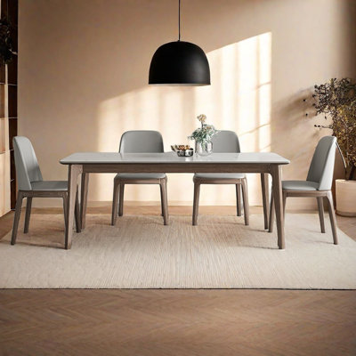 Modern dining table and chair set with rock slab.