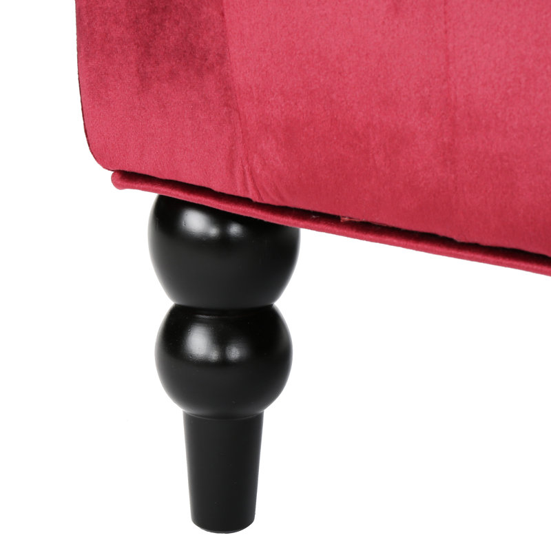 Bouton à oreilles en velours rouge vin somptueux avec un capitonnage exquis
