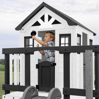 Backyard Discovery Sweetwater Heights White Cedar Wooden Elevated Kids Playhouse with Wave Slide, Play Kitchen, and Deck