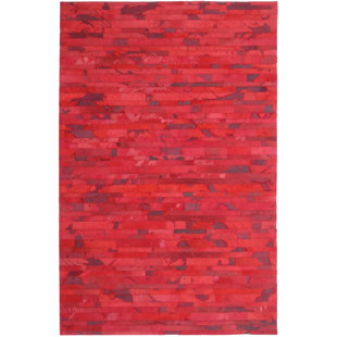 Tapis rouge vache fait main Ademola