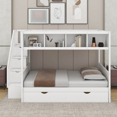 Lit simple superposé au dessus d'un lit double avec tablettes et tiroirs