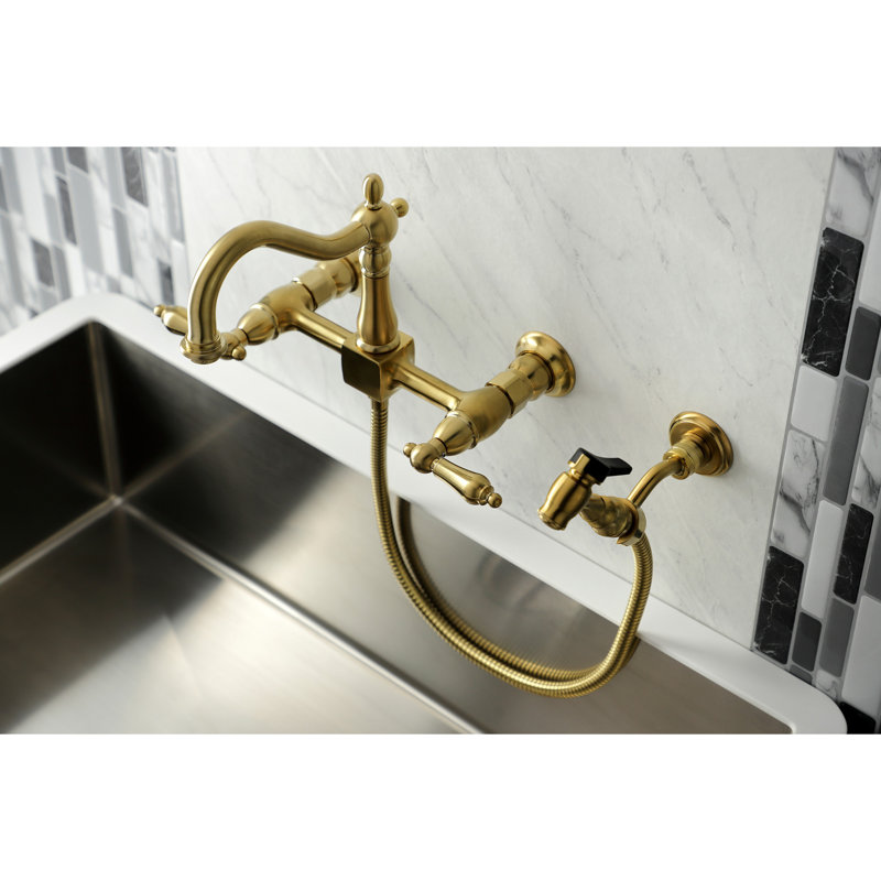 Kingston Brass Heritage Double-Handle 3-Hole Wall-Mount Bridge Kitchen Faucet with Brass Sprayer, Satin Brass