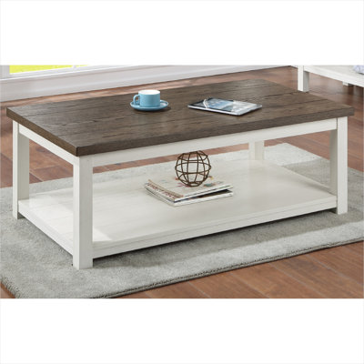 Table basse avec base blanche douce et plateau brun, style maison de campagne, roulettes pour le salon