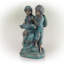 Statue de fille et de garçon lecture conjointe Yadiel