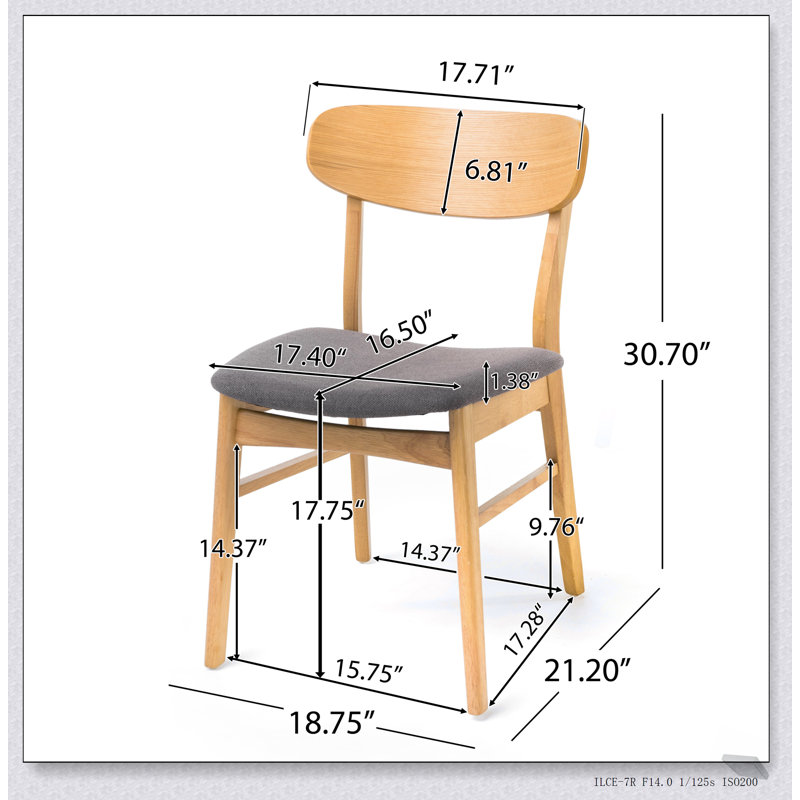 Chaise de salle à manger confortable en tissu avec coussin épais et structure en bois durable, parfaite pour les expériences culinaires élégantes et confortables.