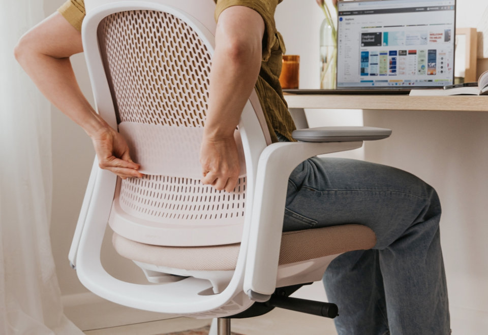 Adjustable lumbar support cradles your lower back for personalized comfort.