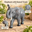Statue d'éléphant de jardin avec trompe levée
