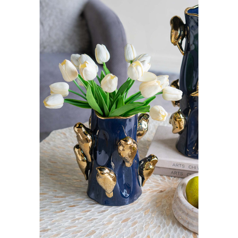 Vase en céramique avec branches d'oiseaux