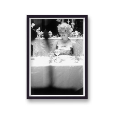 Marilyn Monroe Sat Alone At Function Smiling Photographed From A Distance - Single Picture Frame Print