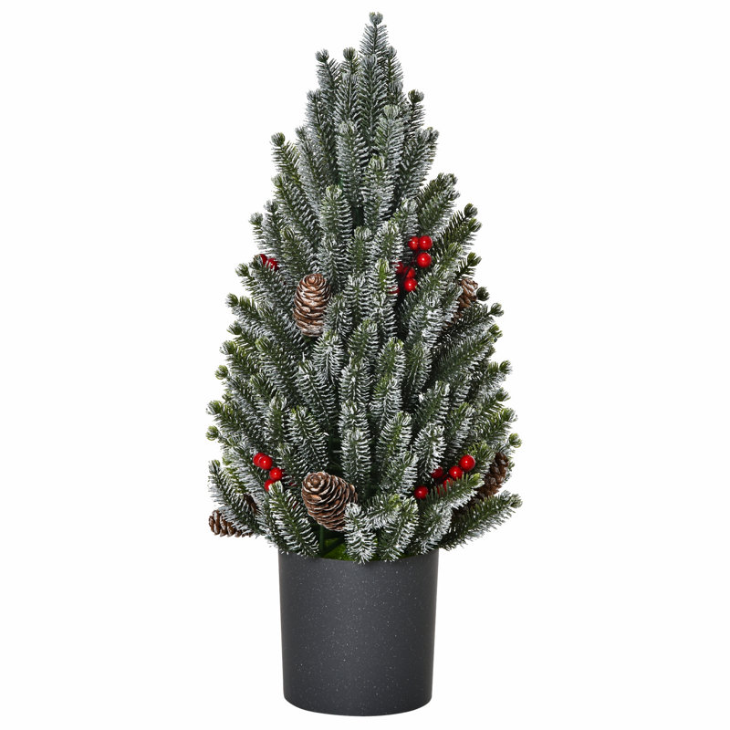 Petit arbre de Noël artificiel avec pommes de pin et baies