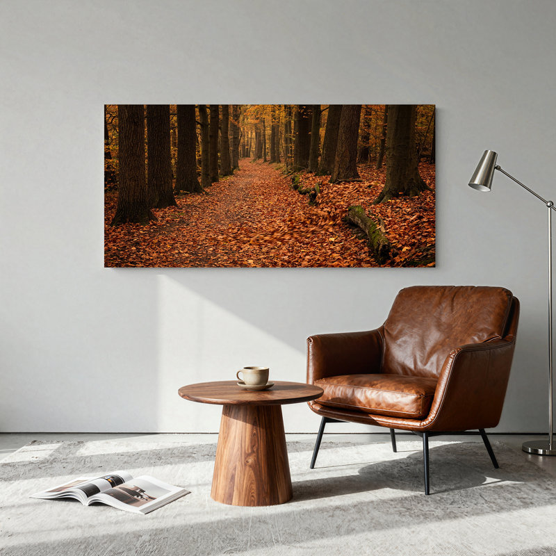Tableau sur toile représentant un chemin forestier avec des troncs moussus et des feuilles d'oranger tombées
