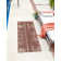 Loreen Geometric Machine Woven Rectangle Polypropylene Indoor / Outdoor Area Rug in Rust Red