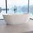63 in. L X 31 in. W Solid Surface Freestanding Soaking Modern Bathtub With Center Drain Overflow  in Matte  White