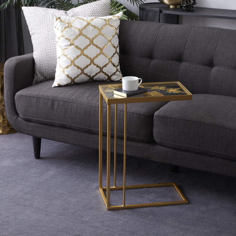 Metal side table with transparent glass top