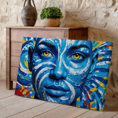 Canvas A Vibrant And Intricate Artwork Featuring A Close Up Of Wall Art A Human Face Predominantly Painted In Shades Of Blue Canvas Wall Art