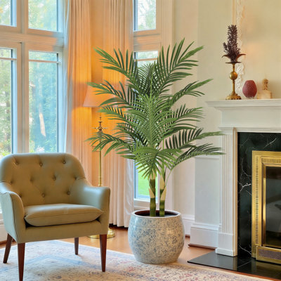 Faux palmier en pot avec écorce véritable et feuilles réalistes pour intérieur et extérieur.