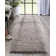 Tapis à poil long texturé tressé de couleur unie Well