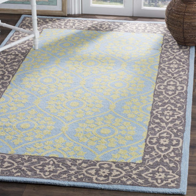 Guzi Hand Hooked Wool/Cotton Oriental Rug in Chocolate/Yellow