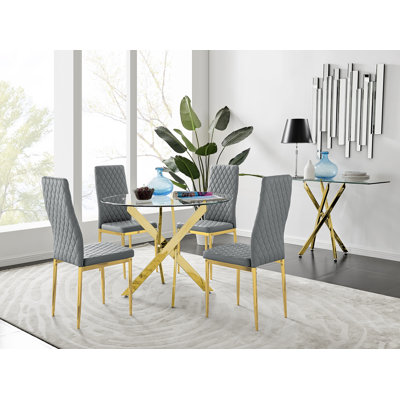 Ensemble de table de salle à manger ronde en métal et verre Tierra avec 4 chaises de salle à manger rembourrées en similicuir