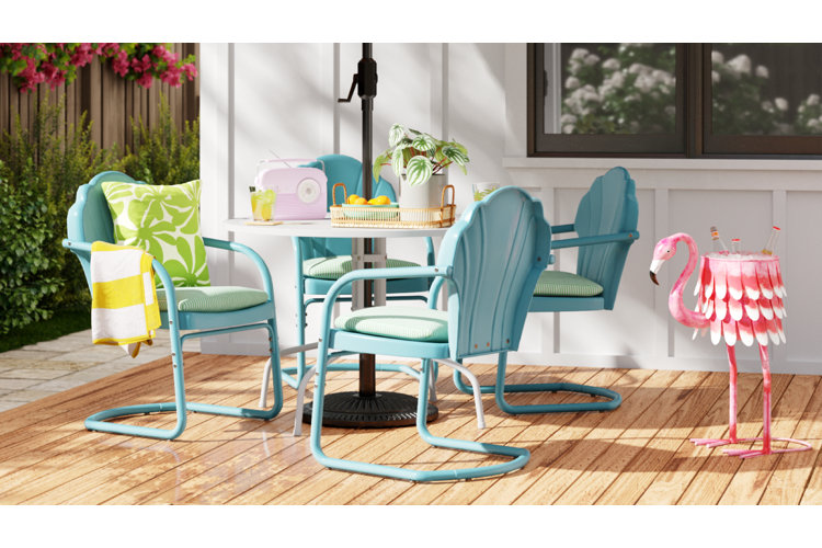 small patio dining area with a flamingo plant pot acting as a drink container