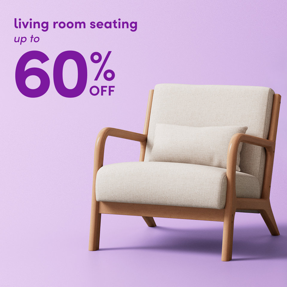 Living room seating up to 60% off featuring a light-toned wooden armchair with beige upholstery and a matching lumbar pillow against a purple background.