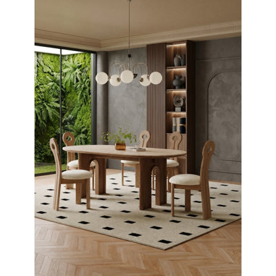 Ensemble de table et de chaises de salle à manger ovales avec 4 chaises rembourrées, style moderne du milieu du siècle, plateau en pierre et piètement arqué.