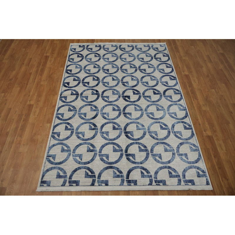 Tapis sophistiqué à motif de cercles dans des tons de bleu doux 5 x 8