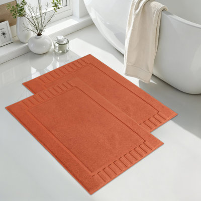 Tapis de bain 100% coton à bordure géométrique