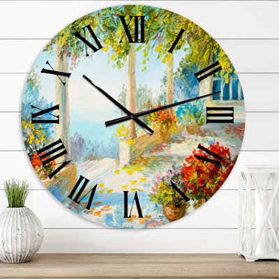 Terrasse près de la mer avec des fleurs rouges - horloge murale nautique et côtière
