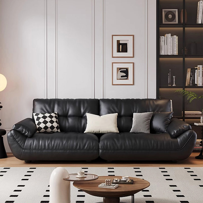Causeuse-coussin modulable noire en cuir véritable