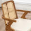 Chaise moderne rembourrée en similicuir à dossier en rotin-745583682