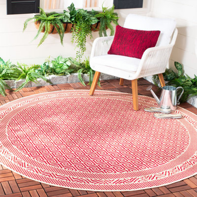 Tapis intérieur / extérieur beige / rouge à motif géométrique Arneshia