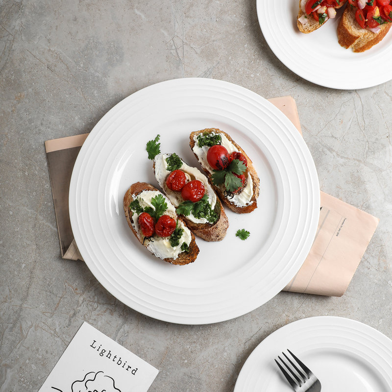 Elegant White Porcelain 16-Piece Dinnerware Set with Swirl Design